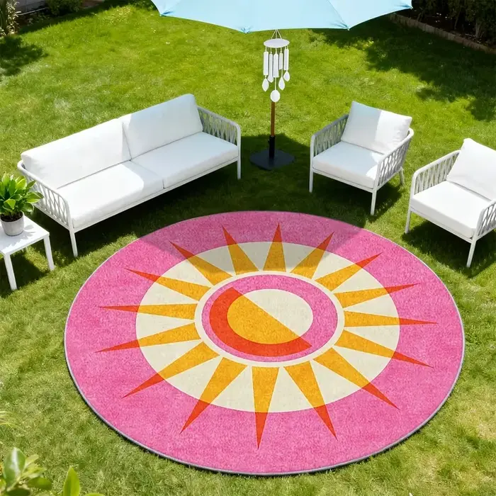 Tapis rond d'extérieur rose rétro à rayons de soleil