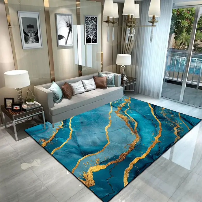 Tapis abstrait moderne de luxe bleu sarcelle avec veines de marbre doré pour salon et chambre à coucher