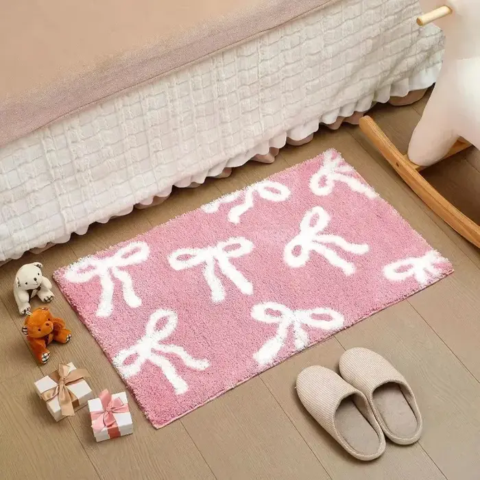 Tapis de bain rose avec nœud papillon VIKAMA