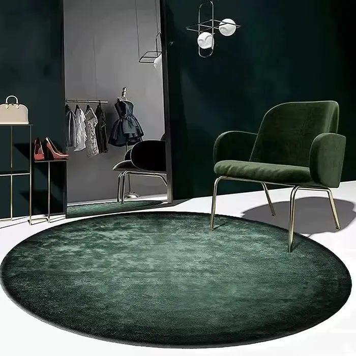 Tapis rond vert foncé de couleur unie