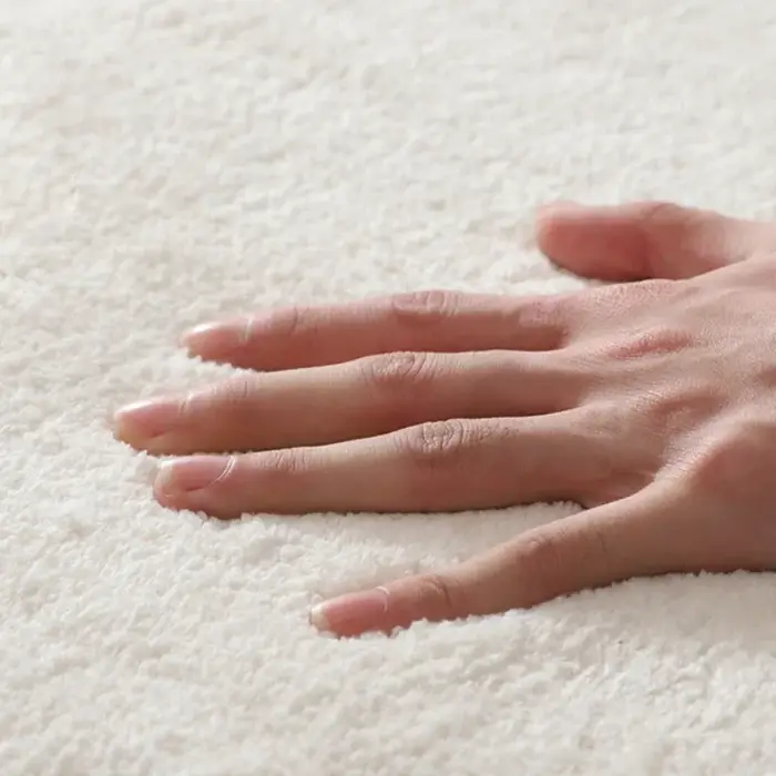 Tapis rond en peluche avec pompon pour salon